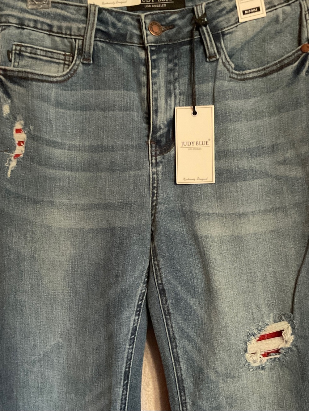 Judy Blue Light Blue Distressed Jeans with Red Patch Detail